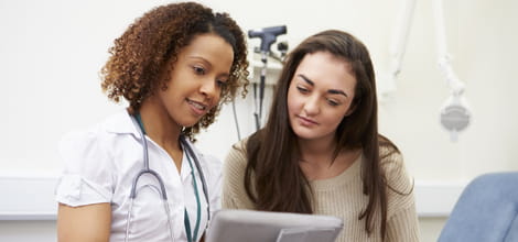 Nurse showing patient tablet